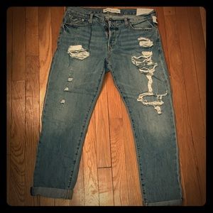 Comfy boyfriend jeans with ripped legs.